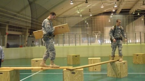 Team members use three wooden planks to cross from one side of
the court to the other without falling off or touching the
floor.

