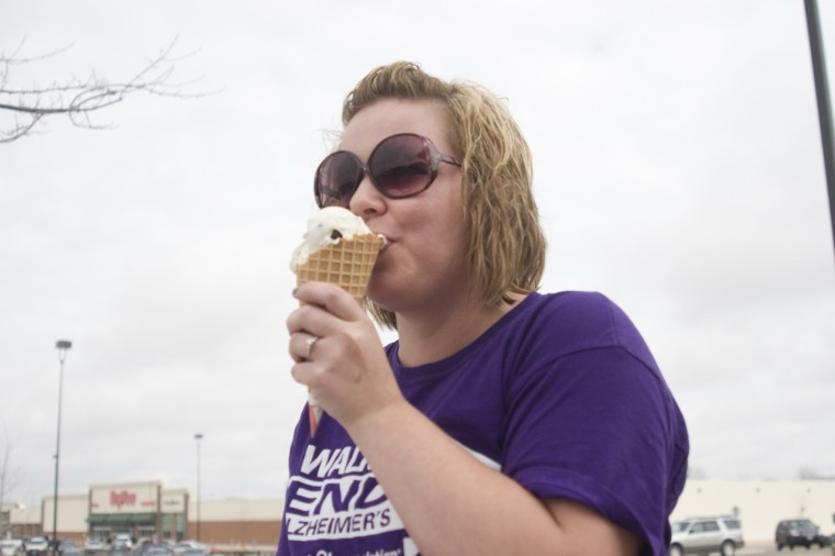 Courtney Hollifield, Kishwaukee Community College nursing major eats cookies and cream frozen custard at Ollies re-opening Wednesday afternoon.
