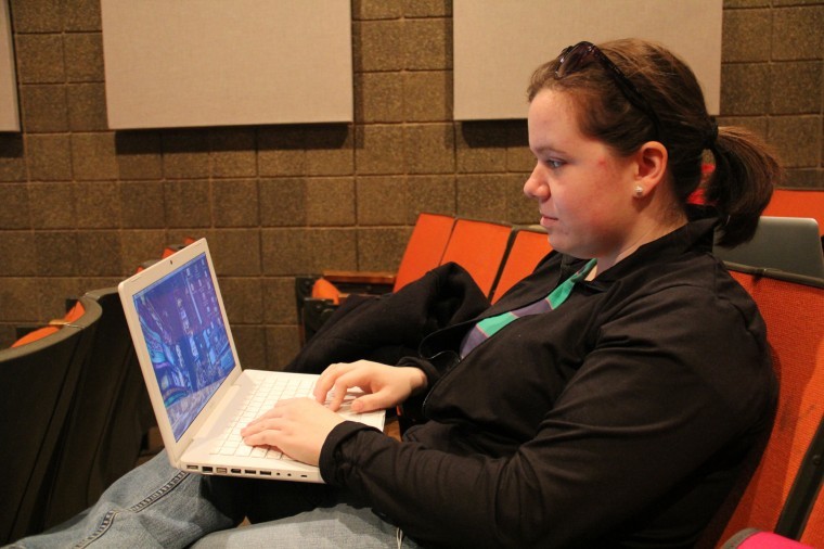 Senior marketing major Marissa Jambrone, uses her laptop
computer before class in the Jack Arends Visual Arts Building
Monday afternoon.
