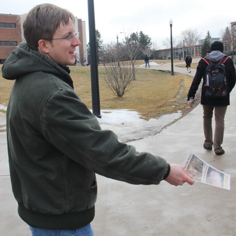 Jon Bockman of St. Charles, 28, NIU Alumnus and Executive
Director of Justice for Animals, hands out Vegan Outreach pamphlets
Wednesday near DuSable Hall to raise awareness about animal
cruelty.
