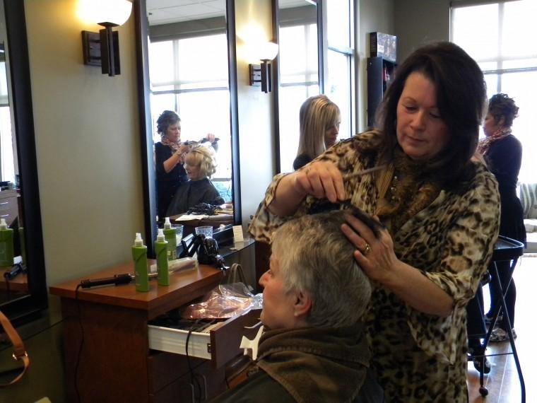 Jane+Levinsky%2C+owner+of+Studio+One+Salon+and+Spa+1007+N.+First%0ASt.+Dekalb%2C+trims+a+clients+hair+Wednesday+afternoon.%0A