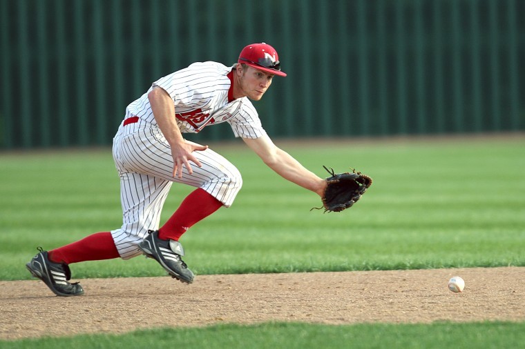 Shortstop Alex Jones watches a grounder into his glove during Tuesdays 5-4 victory.
