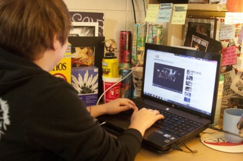 Sophomore Illustration major Avery Muether watches music videos on YouTube in her dorm room Tuesday afternoon. A goal of President Peter's Vision 2020 plan is for NIU to improve wireless internet on campus.