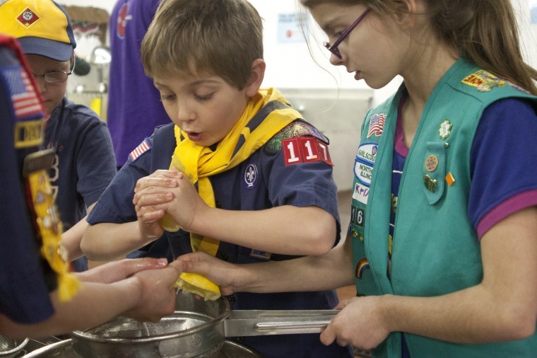 William Stewart, 7, and Kristen Ortman, 10, squeeze lemons to make lemon bars during the Baking with Alex event at Feedem Soup, 122 South First Street, DeKalb Tuesday evening. The event is held every second, fourth and fifth Tuesday of each month.
