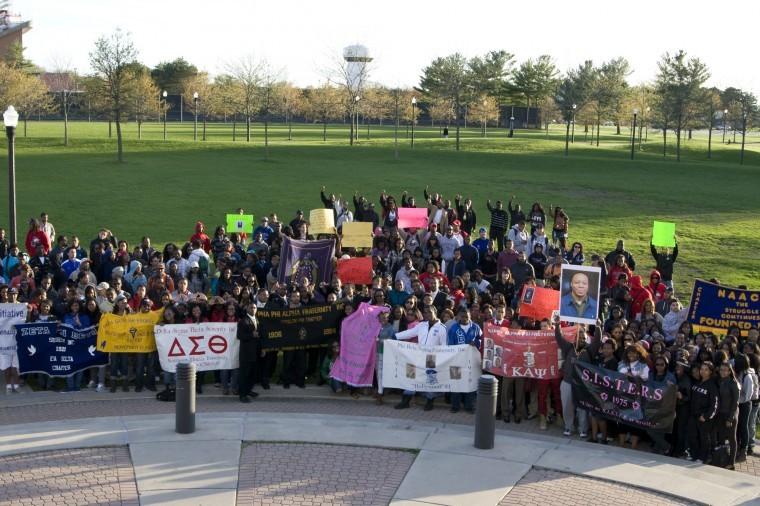 NIU students participate in Breaking the Ice, a rally to protest violence, held across campus Wednesday afternoon. Students gathered to pray in Central Park, led by members of Alpha Phi Alpha.
