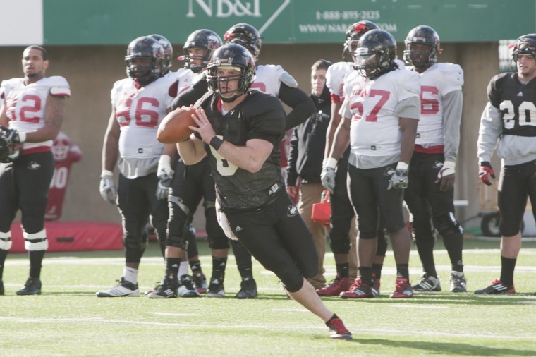 Jordan Lynch runs with the ol pigskin at a spring practice for the NIU football team in Huskie Stadium Monday afternoon.
