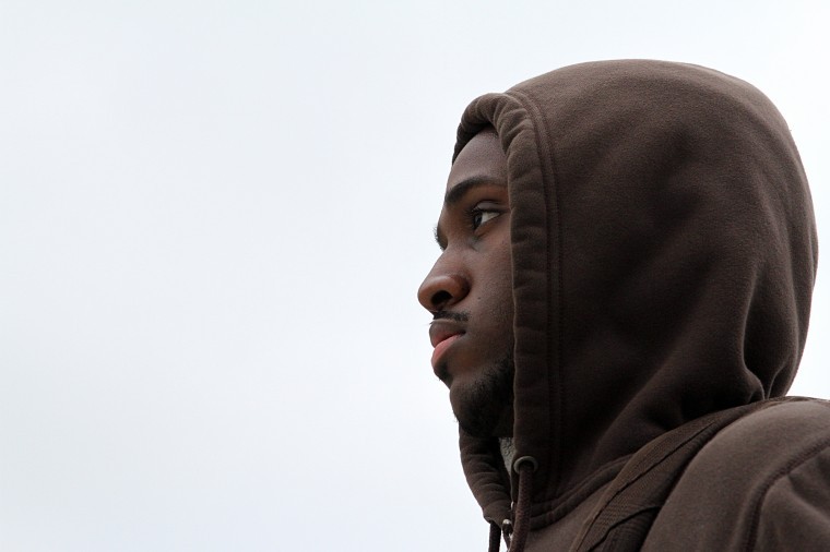 Harold Raddle Jr., fourth year mechanical engineering major, wears a hoodie at the vigil for Trayvon Martin Friday afternoon.
