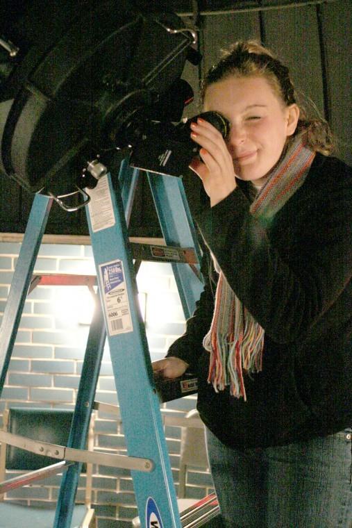 Courtney Vadnais, freshman translation and business spanish major, looks through the Davis Hall Oberservatorys telescope to see the stars in November 2011.
