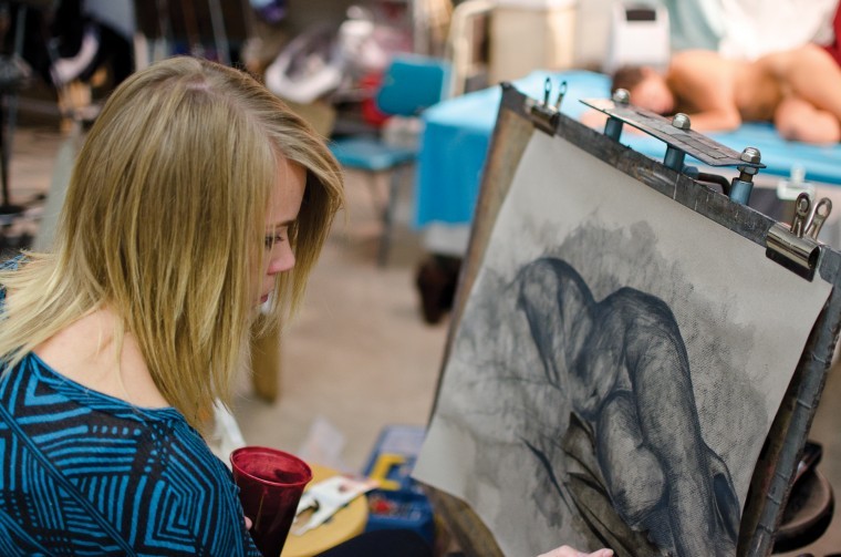Bailey Johnson, sophomore art education major, uses charcoal and water to portray nude model Illyana Rodriguez in ARTS 200, Wednesday. The life drawing class is focused on teaching students how to properly draw human form without barriers.
