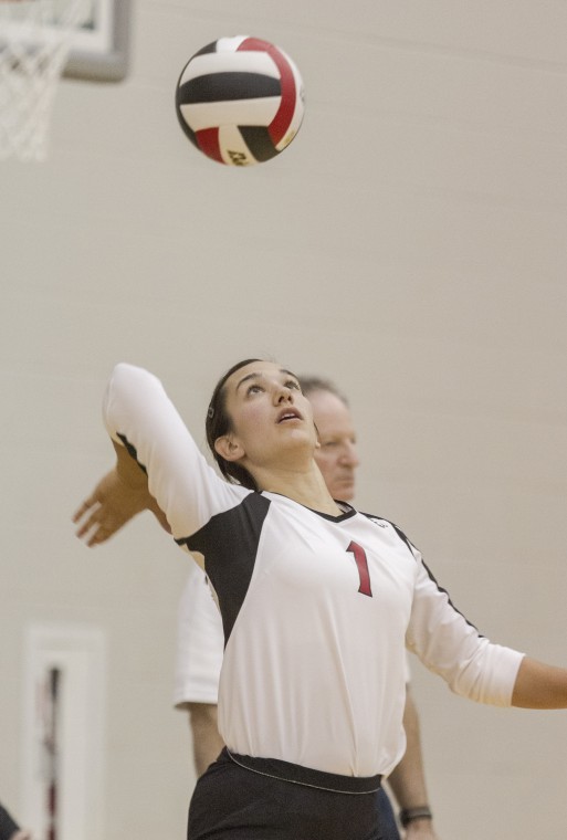 Justine Schepler defensive specialist for Northern Illinois University women’s volleyball team serves the ball in a game early this season.
