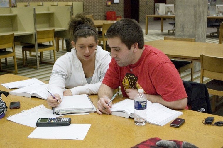 Sophomore business administration majors Michelle DiVita (left) and Nick Nudo (right) study at Founders Memorial Library.
