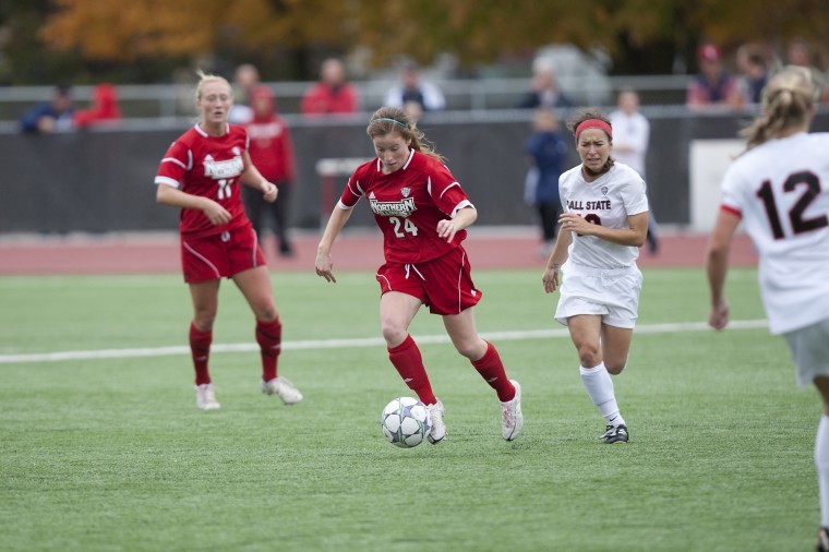 Northern Illinois University mid fielder Emily Nulty, 24 makes her way up the field against Ball State.
