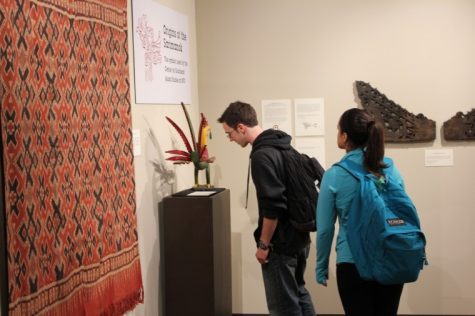Sophomore Finance major, Zachary Zehme and Sophomore Elementary Education major, Gabriela Godinez view a piece at the Anthropology Museum's new Southeast Asia Exhibit in Cole Hall Tuesday afternoon.