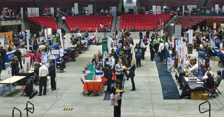 The main floor was filled with recruiting tables and business posters along with the upper level ring around the Convocation Center on Wednesday. Several of the recruiters present are NIU alumni, and were bringing the business world full cirlce to current NIU students. The Job Fair this fall hosted more employers and students than ever before, showing promise of job growth in the area.

