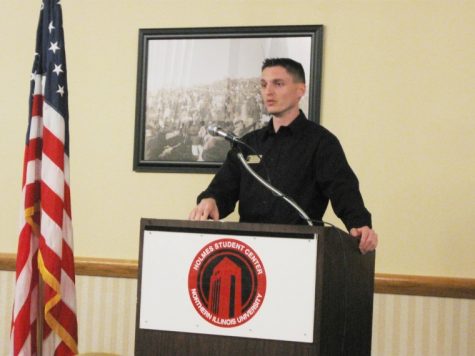 Nick Bender, junior business administration major, presents an essay on the importance of voting in the Sky Room in the Holmes Student Center Monday.