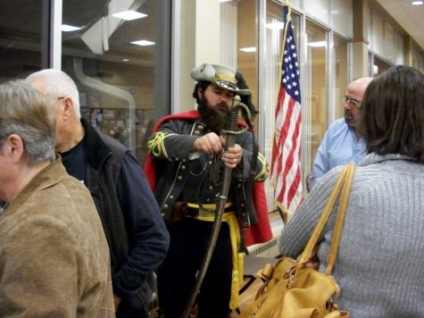 Reenactor Andy Hare portrays General J.E.B. Stuart describing his weapons to guests of