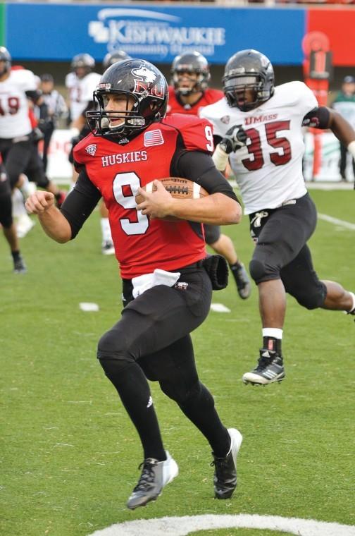 NIU quarterback Matt McIntosh (9) runs the ball towards the endzone during Saturdays victory over the Minutemen 63-0.
