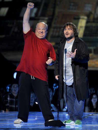 Kyle Gass, left, and Jack Black, of musical duo Tenacious D, present an award on stage at Spikes 10th Annual Video Game Awards at Sony Studios on Friday, Dec. 7, 2012, in Culver City, Calif. (Photo by Chris Pizzello/Invision/AP)
