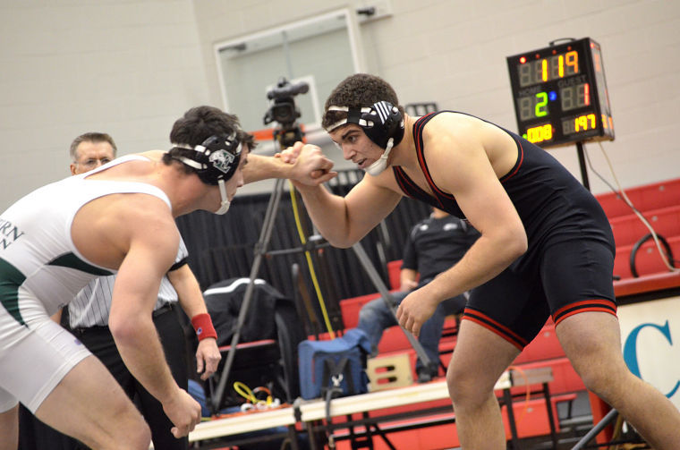 Sophomore Parker Settecase ties up with an opponent from Eastern Michigan University at the meet on Saturday.
