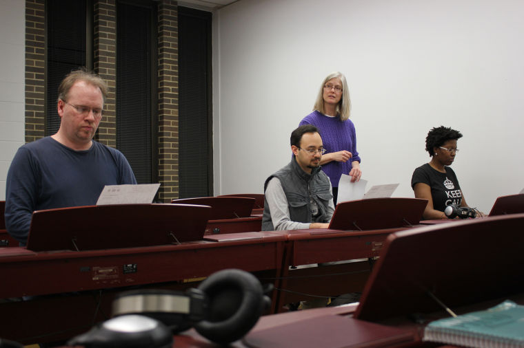 Piano instructor Susan Hurm watches as (left to right) Ted McCarron, Ali Rastegarpour, and Kasey Twine perform a piano piece at a piano recital in the Music Building on Monday night.
