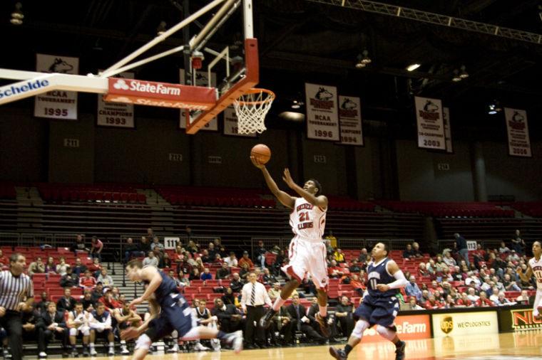 James McCarter | Northern Star Sophomore Forward Keith Gray for Northern Illinois University goes up for a layup during the Huskies game against Akron.
