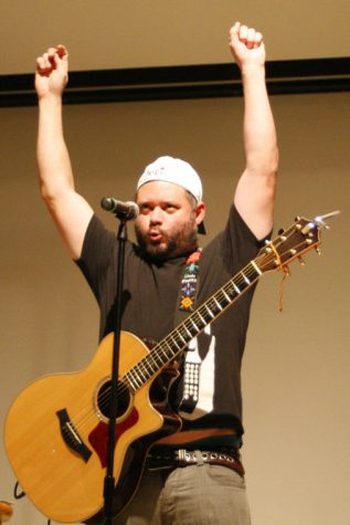 J. Chris Newbirg tells a joke at a comedy show held in the Carl Sandburg Auditorium on Sunday night.