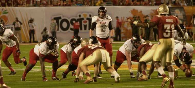 NIU and FSU players prepare to battle out another play during the 2013 Orange Bowl game. The Huskies lost, 31-10.