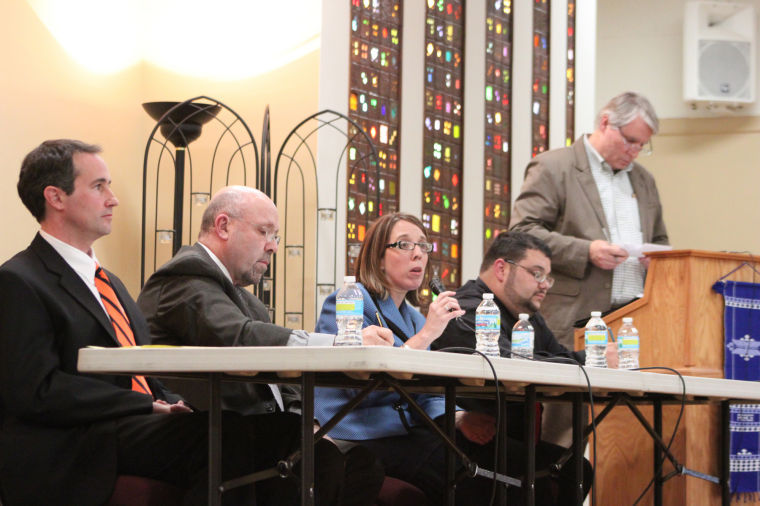 DeKalb mayoral candidates (from left to right) Mark Verbic, John Rey, Jennifer Groce and David Jacobson respond to citizens questions during a candidates night event on Thursday which was moderated by Dan Kenney (far right) of the Unitarian Universalist Fellowship of DeKalb, 158 N. Fourth St.
