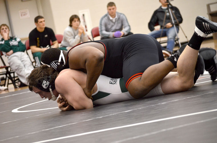 Red shirt junior, Jared Torrence grapples with an opponent at a wrestling meet.
