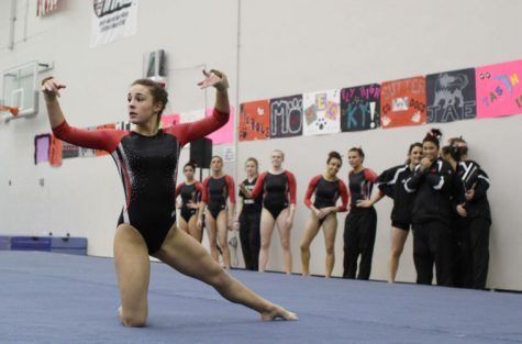 Sophomore Amanda Stepp strikes a pose during her floor routine at the meet against Eastern Michigan University on March 1.