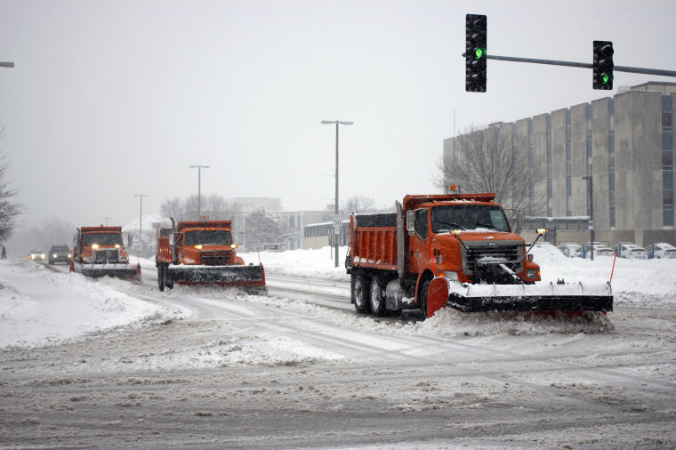 DeKalb snowplows plow Lucinda Ave. during the heavy snowfall.