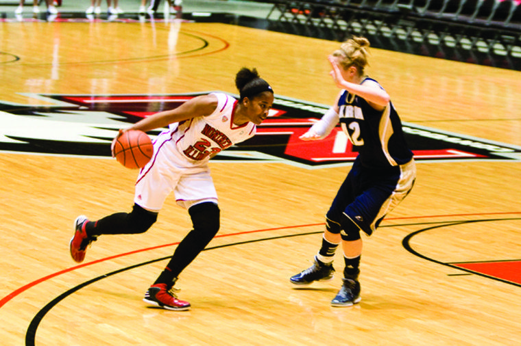 Sophomore forward Jada Buggs attacks the basket during the Huskies game against the Akron Zips.
