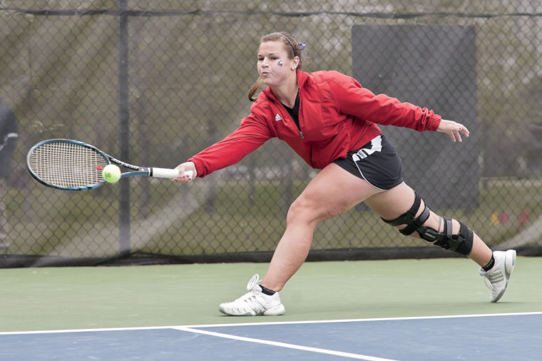 Sophomore Nelle Youel returns a serve during a tennis match against the University of Akron last season.
