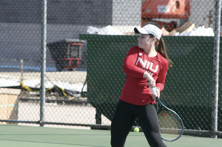 Sophomore Nelle Youel returns a serve on March 29 in a match against Bowling Green University.
