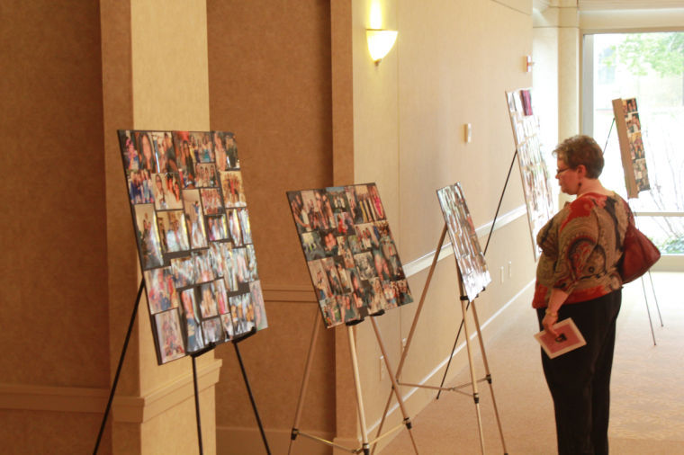 NIU social worker Kim Cecil views photographs of Danielle Marie Pisterzi on Sunday at the memorial for her in which a scholarship in her honor was announced in the Barsema Visitor & Alumni Center.
