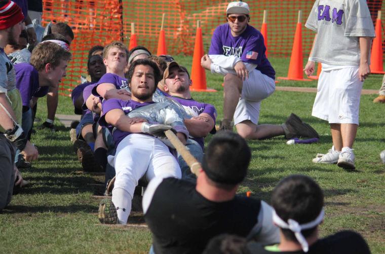 Members of Sigma Alpha Mu compete against Delta Chi and Phi Kappa Sigma Monday at the annual Tugs competition held adjacent to Huskie Stadium.
