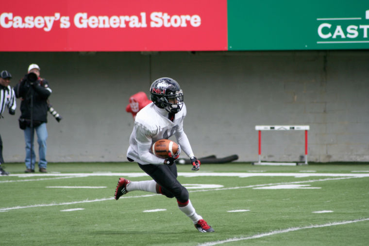 Junior Wide-Reciever Tommylee Lewis runs the ball on Saturday during the Spring football scrimmage.
