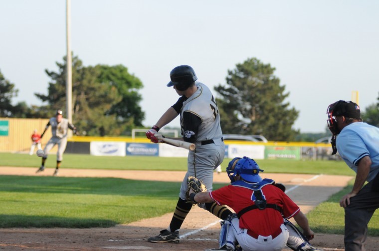 NIUs Jeff Zimmerman, playing for Hannibal, drives a single to
the outfield Sunday night.

