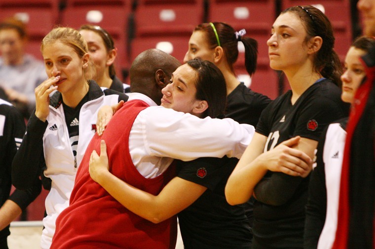 Ray Gooden consoles freshman Justine Schepler (middle) after falling to Ohio in the MAC Tournament Championship.