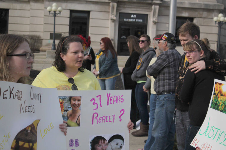 Thelma Holderness (center), of Summoning of Yellow speaks to peaceful protestors on Monday afternoon outside of the Sycamore Court House. Protestors gathered to speak out against the plea deal that William Kurl recieved in exchange for confessing to the murder of Toni Keller.

