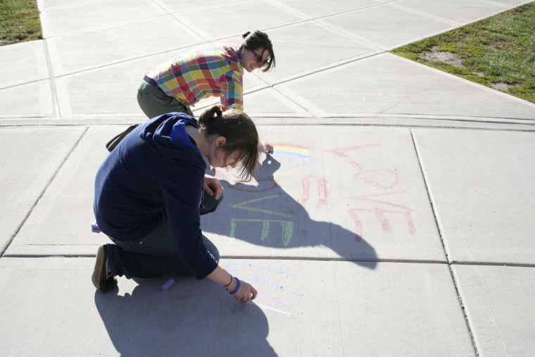 LGBT History Month supporters chalk campus