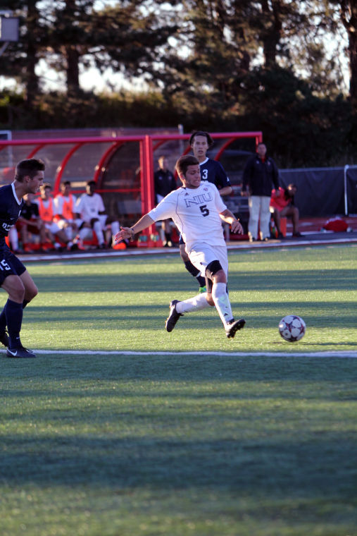 Junior MF/F Andrew Palumbo (5) defends the bgall on the Sep. 13 game against Butler.
