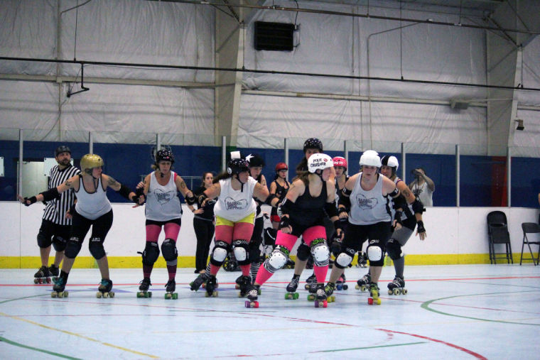 The Barbed Wire Betties practice during a scrimmage match Friday night at Kishwaukee YMCA, 2500 W. Bethany Road.