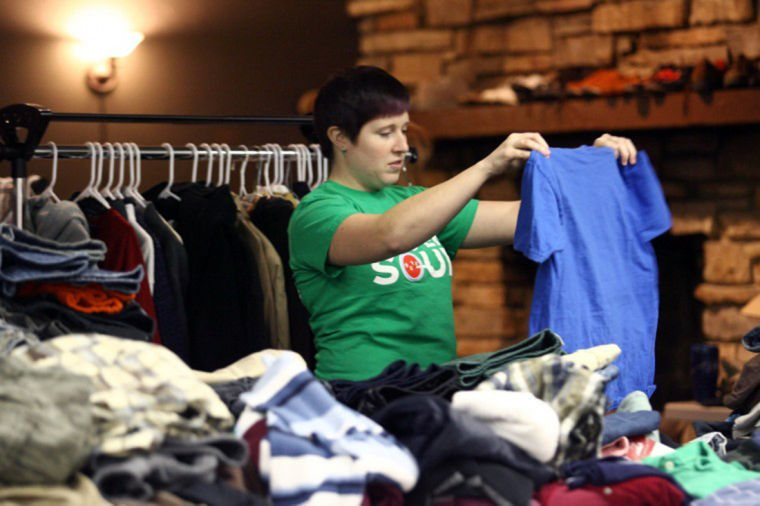 Randi Kennedy, marketing and management major at Kishwaukee Community College, folds shirts at Feed’em Soup’s clothing closet, 122 S. First St., in April 2012. Feed’em Soup, which is in need of some technological updates, lost a contest that could have garnered it a technology makeover.