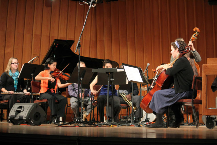 The New Music Ensemble plays in the Music Building at the Boutell Memorial Concert Hall Tuesday night. The concert series brings students and guests artists onstage, providing a “nice change” in sound, said attendee Kayla Steger, freshman cello performance major.