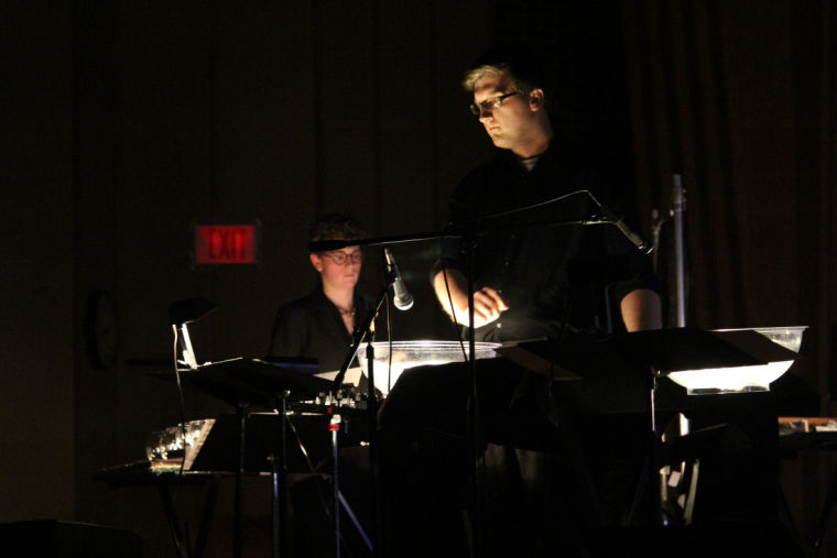 School of Music members performed during the premiere of Jeff Herriott’s “The Stone Tapestry” Sunday at the Music Building’s Boutell Memorial Concert Hall. The ensemble implemented water droplet sound effects by dropping stones into bowls of water and ran projections of natural environments in the background.