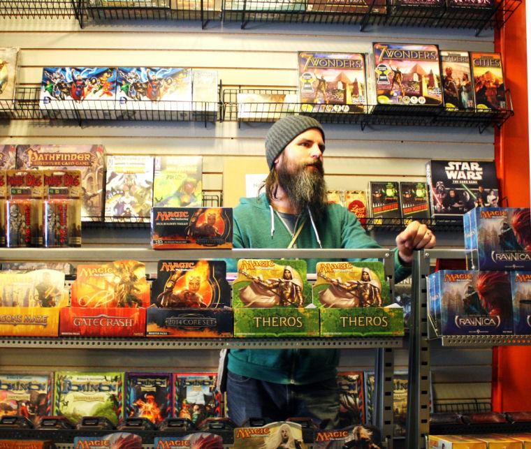 Alan+Hubbard%2C+The+Gaming+Goat+manager%2C+stands+behind+a+display+desk+at+The+Gaming+Goat%2C+311+E.+Lincoln+Highway.+The+store%2C+which+opened+Saturday%2C+sells+board+games%2C+trading+cards+and+more.