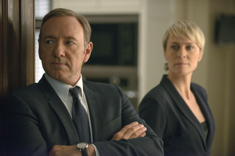 (Left) Francis Underwood (Kevin Spacey) stands next to (right) Clair Underwood (Robin Wright) in a scene from House of Cards. The second season began Feb. 14.