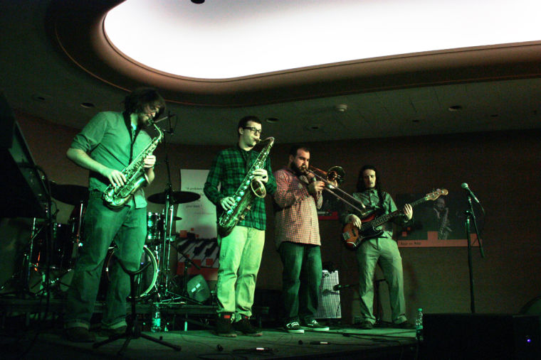 Higher Vibe, a student band, performed Friday night at the Holmes Student Center’s Duke Ellington Ballroom. Musicians performed before the audience turned its attention to an exhibit that showcased student art.