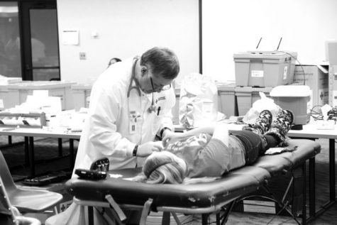 Freshman sociology major Jacklyn Wimmer donates blood during a blood drive hosted by Delta Sigma Theta Monday in the Stevenson Multipurpose Room. With blood banks being low due to cold weather and lack of awareness, the Heartland Blood Center is in need of blood donors.
